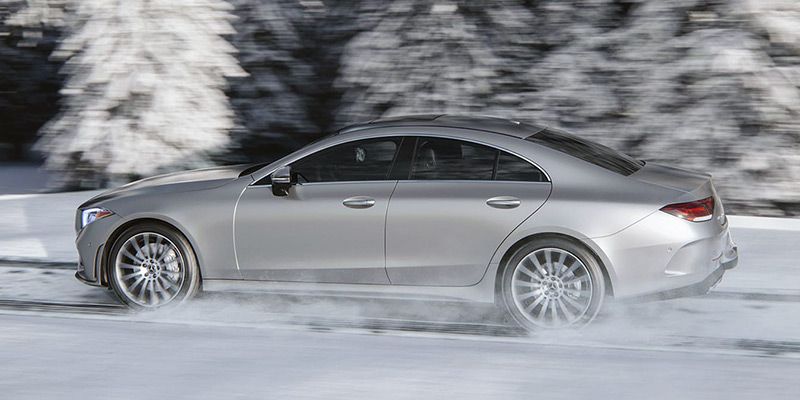 Silver 2020 Mercedes-Benz CLS driving in the snow in Dublin, OH